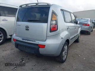2011 Kia Soul + with VIN KNDJT2A2XB7705227, listed as a IAAI auction lot 41942432 with 293,320 mi miles. Bid and sale history available at carsss.com. Image 4.