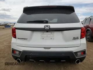 2023 Honda Passport Elite with VIN 5FNYF8H05PB013536, listed as a Copart auction lot 50671155 with 33,815 mi miles and Salvage Title. Bid and sale history available at DreamBid. Image 6.
