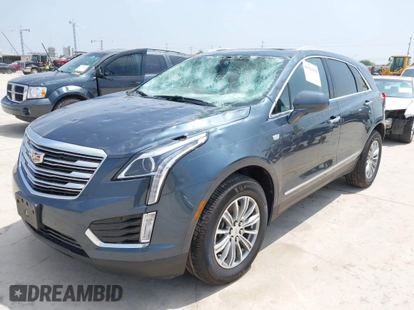 2019 Cadillac XT5 Luxury FWD z VIN 1GYKNCRS1KZ259282, wystawiony jako IAAI lot #41921030 z przebiegiem 27 880 mil mil oraz . Historia ofert i sprzedaży dostępna na DreamBid. Obrazek 19.