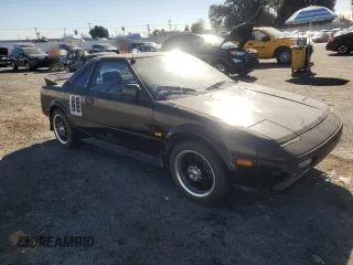 1986 Toyota MR2 z VIN JT2AW15C8G0053673, wystawiony jako Copart lot #88160225 z przebiegiem 165 867 mil mil oraz Szkody całkowita. Historia ofert i sprzedaży dostępna na DreamBid. Obrazek 4.