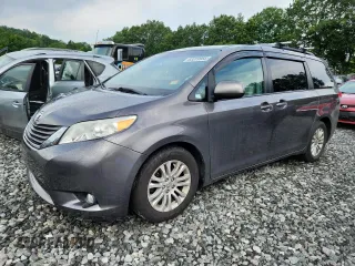 2014 Toyota Sienna XLE with VIN 5TDYK3DC0ES444096, listed as a Copart auction lot 63319955 with 230,252 mi miles and Clean title. Bid and sale history available at DreamBid. Image 1.