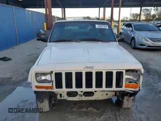 1999 Jeep Cherokee Sport with VIN 1J4FT68S6XL578679, listed as a Copart auction lot 76697394 with 196,110 mi miles and Salvage title. Bid and sale history available at DreamBid. Image 5.