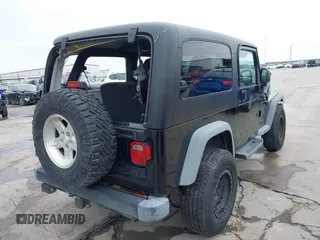 2004 Jeep Wrangler Sport with VIN 1J4FA49S64P794559, listed as a IAAI auction lot 41644201 with 107,445 mi miles. Bid and sale history available at carsss.com. Image 4.
