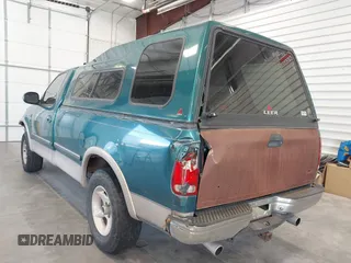 1997 Ford F-150 z VIN 1FTEF18L3VKC01590, wystawiony jako IAAI lot #41807198 z przebiegiem 210 000 mil mil oraz . Historia ofert i sprzedaży dostępna na DreamBid. Obrazek 3.