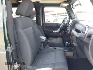 2012 Jeep Wrangler Sahara z VIN 1C4AJWBGXCL100527, wystawiony jako IAAI lot #42394623 z przebiegiem 126 097 mil mil oraz . Historia ofert i sprzedaży dostępna na DreamBid. Obrazek 5.