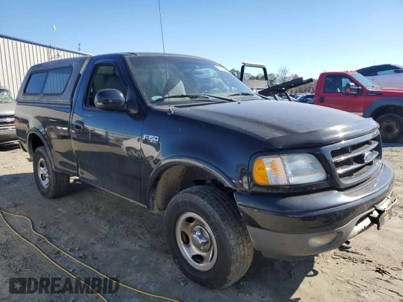 2002 Ford F-150 XL with VIN 1FTRF18232NA58109, listed as a Copart auction lot 79080674 with 148,213 mi miles and Salvage title. Bid and sale history available at DreamBid. Image 4.