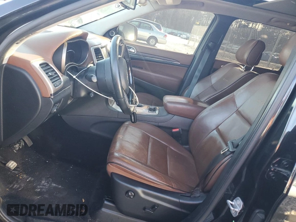 2015 Jeep Grand Cherokee Summit with VIN 1C4RJFJG0FC700014, listed as a Copart auction lot 42981765 with 144,937 mi miles and Salvage Title. Bid and sale history available at DreamBid. Image 7.