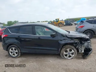 2014 Ford Escape SE z VIN 1FMCU9G9XEUA15367, wystawiony jako IAAI lot #42358528 z przebiegiem 145 994 mil mil oraz . Historia ofert i sprzedaży dostępna na DreamBid. Obrazek 13.