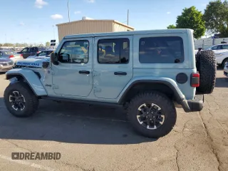 2024 Jeep Wrangler Rubicon z VIN 1C4RJXR64RW279791, wystawiony jako Copart lot #61348324 z przebiegiem 1 387 mil mil oraz Szkoda całkowita • Salvage title. Historia ofert i sprzedaży dostępna na DreamBid. Obrazek 2.