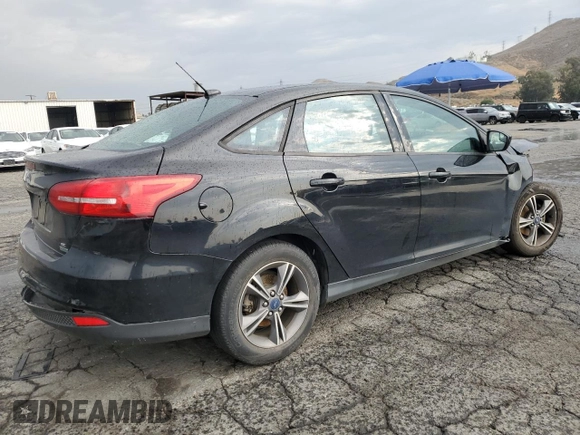 2018 Ford Focus SE with VIN 1FADP3FE8JL300246, listed as a Copart auction lot 59585035 with 83,141 mi miles and Salvage title. Bid and sale history available at DreamBid. Image 3.