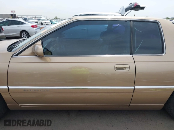 1999 Cadillac Eldorado ESC z VIN 1G6EL12Y5XU603764, wystawiony jako IAAI lot #42368692 z przebiegiem 154 613 mil mil oraz . Historia ofert i sprzedaży dostępna na DreamBid. Obrazek 14.