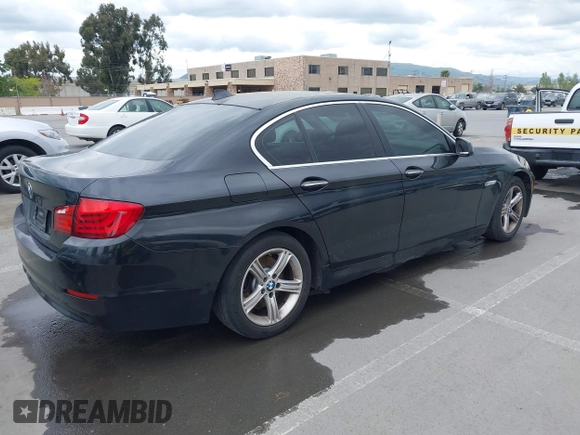 2012 BMW 5 Series 528i with VIN WBAXG5C55CDX02405, listed as a IAAI auction lot 42127069 with 155,764 mi miles. Bid and sale history available at carsss.com. Image 4.