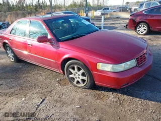 2003 Cadillac Seville Touring STS with VIN 1G6KY54983U212944, listed as a IAAI auction lot 41656796 with 118,662 mi miles. Bid and sale history available at carsss.com. Image 1.