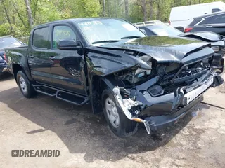 2022 Toyota Tacoma SR with VIN 3TYCZ5AN0NT074683, listed as a IAAI auction lot 42117875 with 51,112 mi miles and . Bid and sale history available at DreamBid. Image 1.
