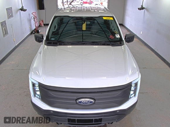 2022 Ford F-150 Lightning Pro with VIN 1FTVW1EL5NWG11725, listed as a IAAI auction lot 42832825 with 5,044 mi miles and . Bid and sale history available at DreamBid. Image 13.