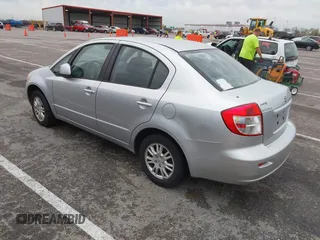 2013 Suzuki SX4 LE with VIN JS2YC5A36D6100791, listed as a IAAI auction lot 41909191 with 180,597 mi miles and . Bid and sale history available at DreamBid. Image 3.