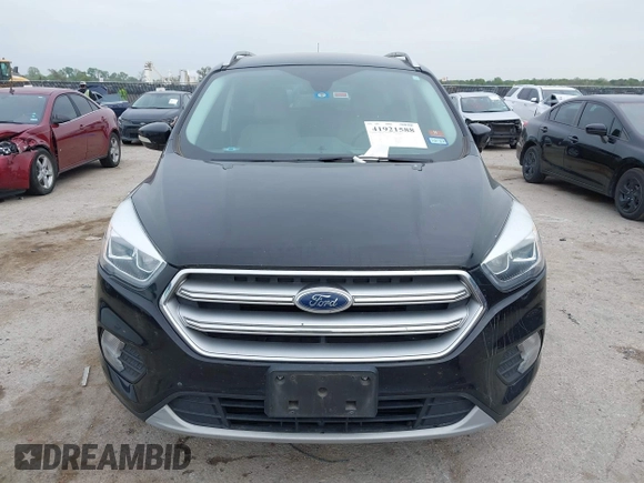 2017 Ford Escape Titanium with VIN 1FMCU0J93HUF10664, listed as a IAAI auction lot 41921588 with 88,377 mi miles. Bid and sale history available at carsss.com. Image 12.