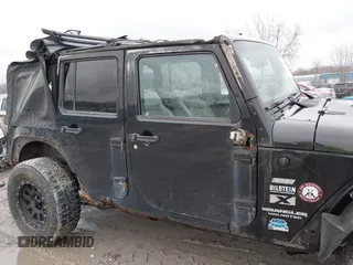 2008 Jeep Wrangler Unlimited X with VIN 1J4GA39138L641138, listed as a IAAI auction lot 41986230 with 215,026 mi miles. Bid and sale history available at carsss.com. Image 14.