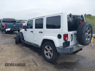 2017 Jeep Wrangler Unlimited Sahara with VIN 1C4BJWEG3HL752719, listed as a IAAI auction lot 41892600 with 127,486 mi miles. Bid and sale history available at carsss.com. Image 3.