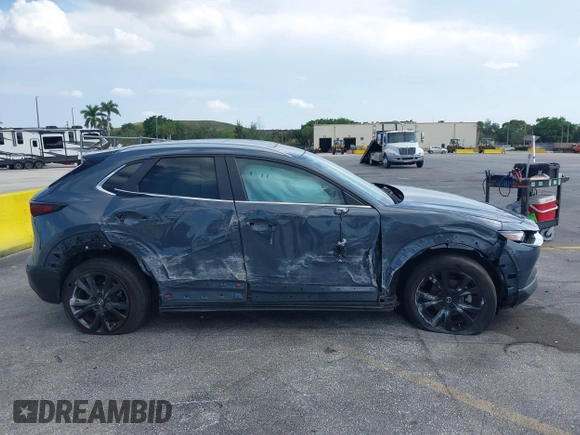2023 Mazda CX-30 S Carbon Edition with VIN 3MVDMBCM4PM579080, listed as a IAAI auction lot 41941082 with 5,444 mi miles and . Bid and sale history available at DreamBid. Image 13.