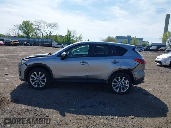 2014 Mazda CX-5 Grand Touring with VIN JM3KE4DY7E0311893, listed as a IAAI auction lot 42090872 with 102,154 mi miles and . Bid and sale history available at DreamBid. Image 14.