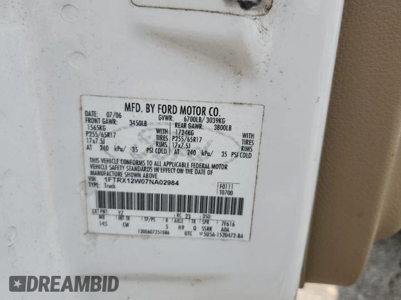 2007 Ford F-150 STX with VIN 1FTRX12W07NA02984, listed as a Copart auction lot 60305325 with 127,731 mi miles and Salvage title. Bid and sale history available at DreamBid. Image 12.