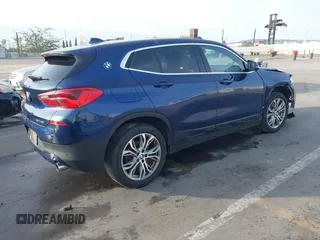2020 BMW X2 sDrive28i with VIN WBXYH9C02L5P01502, listed as a IAAI auction lot 41397416 with 82,660 mi miles. Bid and sale history available at carsss.com. Image 4.