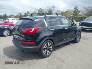 2013 Kia Sportage SX with VIN KNDPCCA61D7385219, listed as a IAAI auction lot 41945345 with 112,471 mi miles and . Bid and sale history available at carsss.com. Image 4.