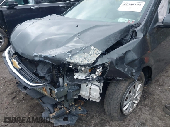 2018 Chevrolet Sonic LT z VIN 1G1JD5SG9J4123931, wystawiony jako IAAI lot #42066158 z przebiegiem 94 959 mil mil oraz . Historia ofert i sprzedaży dostępna na DreamBid. Obrazek 6.