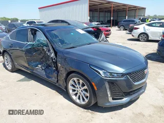 2021 Cadillac CT5 Luxury z VIN 1G6DW5RKXM0144424, wystawiony jako IAAI lot #41985803 z przebiegiem 65 555 mil mil oraz . Historia ofert i sprzedaży dostępna na DreamBid. Obrazek 1.