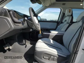 2024 Rivian R1T Adventure z VIN 7FCTGCAA9RN030318, wystawiony jako Copart lot #77036474 z przebiegiem 3 522 mil mil oraz Szkoda całkowita • Salvage title. Historia ofert i sprzedaży dostępna na DreamBid. Obrazek 7.