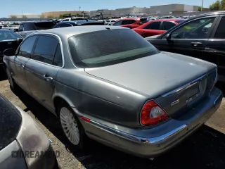 2006 Jaguar XJ Vanden Plas with VIN SAJWA82BX6SH09069, listed as a Copart auction lot 68122604 with 153,999 mi miles and Salvage Title. Bid and sale history available at carsss.com. Image 2.