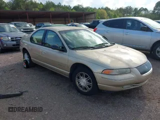 1998 Chrysler Cirrus LXi z VIN 1C3EJ56H1WN250439, wystawiony jako IAAI lot #41903393 z przebiegiem 81 879 mil mil oraz . Historia ofert i sprzedaży dostępna na DreamBid. Obrazek 1.