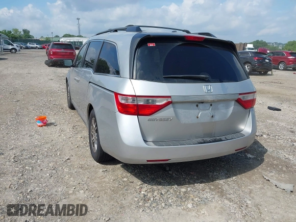 2012 Honda Odyssey EX-L with VIN 5FNRL5H61CB081634, listed as a IAAI auction lot 42760909 with 197,949 mi miles and . Bid and sale history available at DreamBid. Image 3.