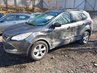 2015 Ford Escape SE with VIN 1FMCU9GX6FUB35649, listed as a IAAI auction lot 42055398 with 128,524 mi miles. Bid and sale history available at carsss.com. Image 2.