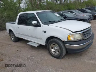 2001 Ford F-150 SuperCrew XLT with VIN 1FTRW07LX1KA24415, listed as a IAAI auction lot 42081030 with 298,673 mi miles. Bid and sale history available at carsss.com. Image 1.