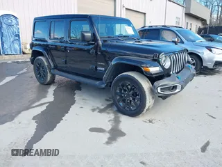 2023 Jeep Wrangler Sahara with VIN 1C4JJXP62PW613040, listed as a IAAI auction lot 41489171 with 36,818 mi miles and . Bid and sale history available at DreamBid. Image 1.