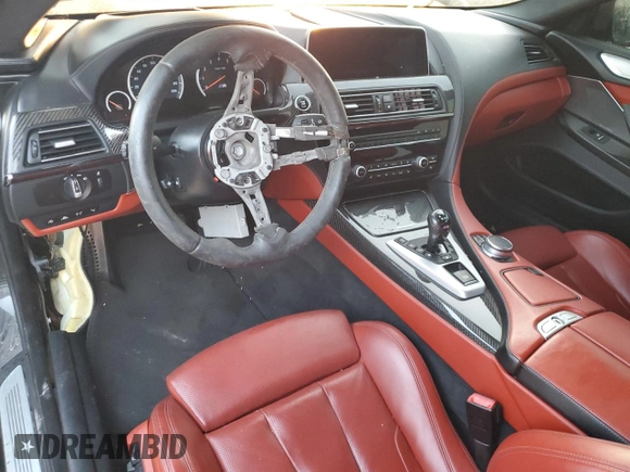 2017 BMW M6 z VIN WBS6J9C3XHD934858, wystawiony jako Copart lot #73714104 z przebiegiem Nie podano mil oraz Szkoda całkowita • Salvage title. Historia ofert i sprzedaży dostępna na DreamBid. Obrazek 8.