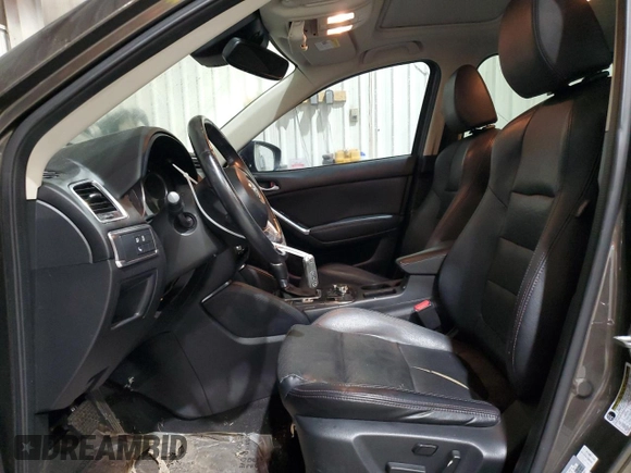 2016 Mazda CX-5 Grand Touring z VIN JM3KE2DY5G0821683, wystawiony jako Copart lot #51929905 z przebiegiem 119 392 mil mil oraz Czysty tytuł • Clean title. Historia ofert i sprzedaży dostępna na DreamBid. Obrazek 7.
