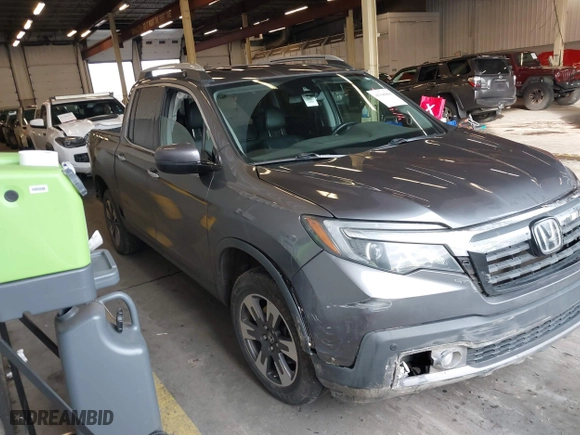 2017 Honda Ridgeline RTL-E with VIN 5FPYK3F73HB034764, listed as a IAAI auction lot 41146866 with 125,885 mi miles. Bid and sale history available at carsss.com. Image 1.