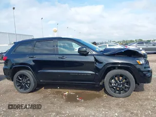2021 Jeep Grand Cherokee Laredo E with VIN 1C4RJEAG0MC571375, listed as a IAAI auction lot 42087648 with 29,358 mi miles and . Bid and sale history available at DreamBid. Image 14.