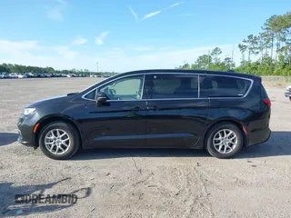 2023 Chrysler Pacifica Touring L with VIN 2C4RC1BG1PR606566, listed as a IAAI auction lot 42615498 with 42,980 mi miles and . Bid and sale history available at DreamBid. Image 14.
