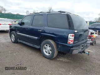 2005 GMC Yukon SLT with VIN 1GKEC13T45J139885, listed as a IAAI auction lot 41796394 with 229,494 mi miles. Bid and sale history available at carsss.com. Image 3.