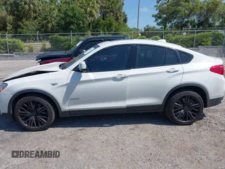 2015 BMW X4 xDrive28i with VIN 5UXXW3C59F0M88331, listed as a IAAI auction lot 42093953 with 138,205 mi miles and . Bid and sale history available at DreamBid. Image 14.