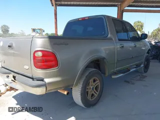 2002 Ford F-150 XLT with VIN 1FTRW08LX2KE43025, listed as a IAAI auction lot 42060641 with 123,507 mi miles. Bid and sale history available at carsss.com. Image 4.