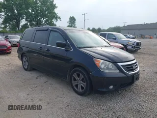 2010 Honda Odyssey Touring with VIN 5FNRL3H91AB044045, listed as a IAAI auction lot 42477551 with 224,088 mi miles and . Bid and sale history available at DreamBid. Image 1.