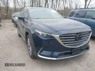 2018 Mazda CX-9 Grand Touring z VIN JM3TCADY4J0216968, wystawiony jako IAAI lot #41829391 z przebiegiem 98 832 mil mil oraz . Historia ofert i sprzedaży dostępna na DreamBid. Obrazek 1.