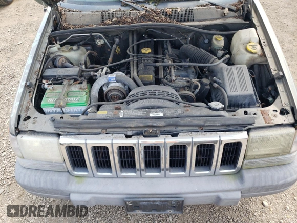 1997 Jeep Grand Cherokee Laredo z VIN 1J4GZ58S4VC502596, wystawiony jako Copart lot #88255865 z przebiegiem Nie podano mil oraz Nie do naprawy • Non repairable. Historia ofert i sprzedaży dostępna na DreamBid. Obrazek 11.