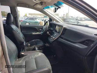 2015 Toyota Sienna SE with VIN 5TDXK3DCXFS680767, listed as a IAAI auction lot 42237107 with 105,912 mi miles and . Bid and sale history available at DreamBid. Image 5.