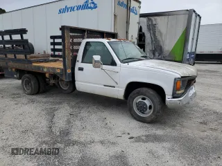 1999 GMC Sierra 1500 with VIN 1GDJC34R3XF087014, listed as a Copart auction lot 86367084 with 94,539 mi miles and Clean Title. Bid and sale history available at DreamBid. Image 4.